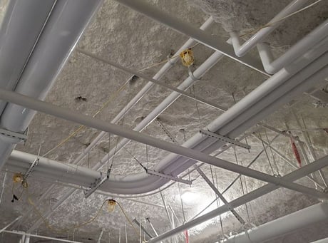 Image of the ceiling of a facility showing seismic restraint installation